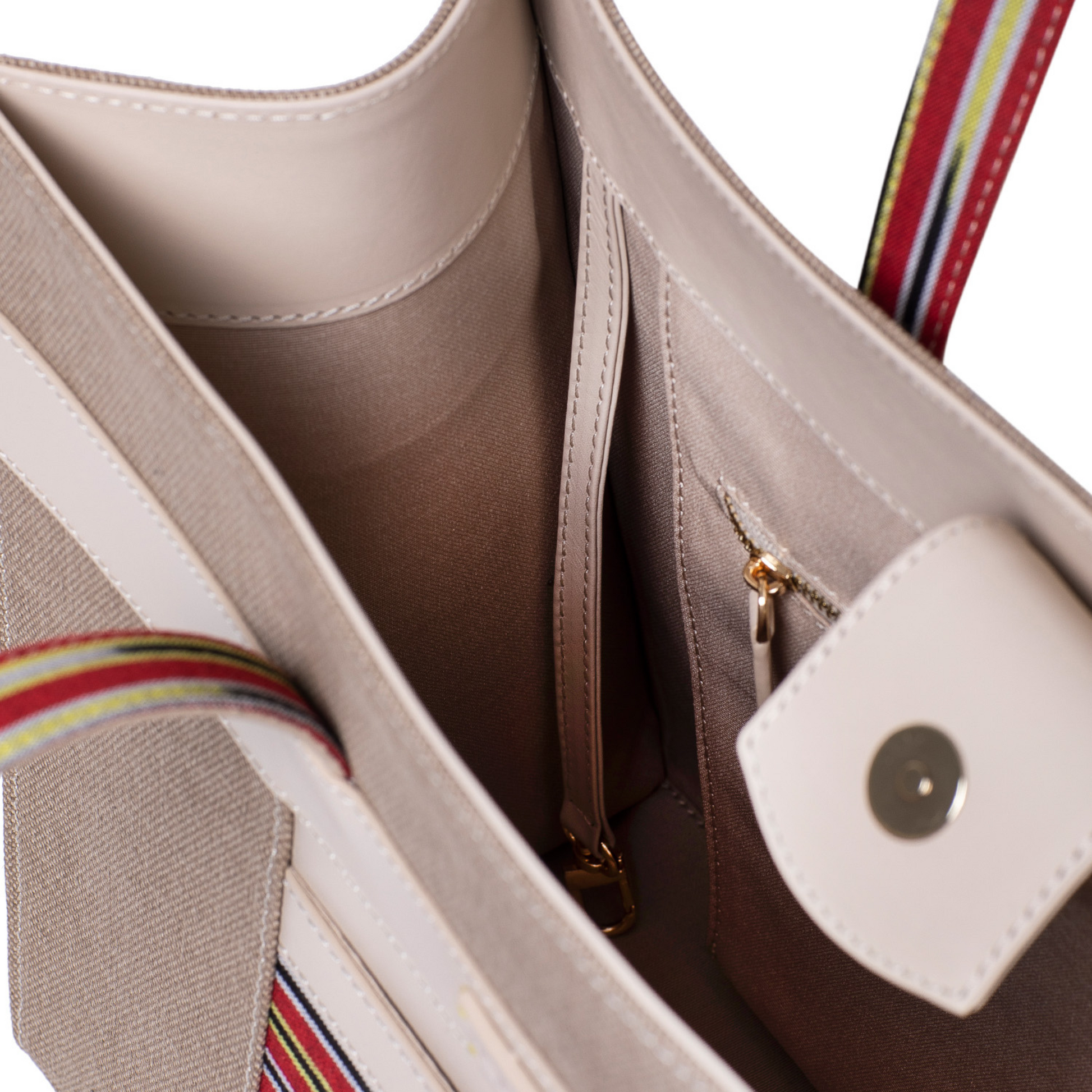 The inside of Zua cream tote bag. A long strap for keys or wallets and zipped large pocket